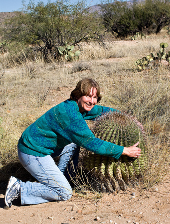Hugging a barrel cactus?